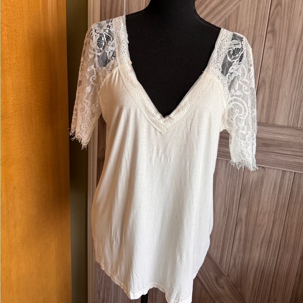 Vici cream colored blouse. Lace top